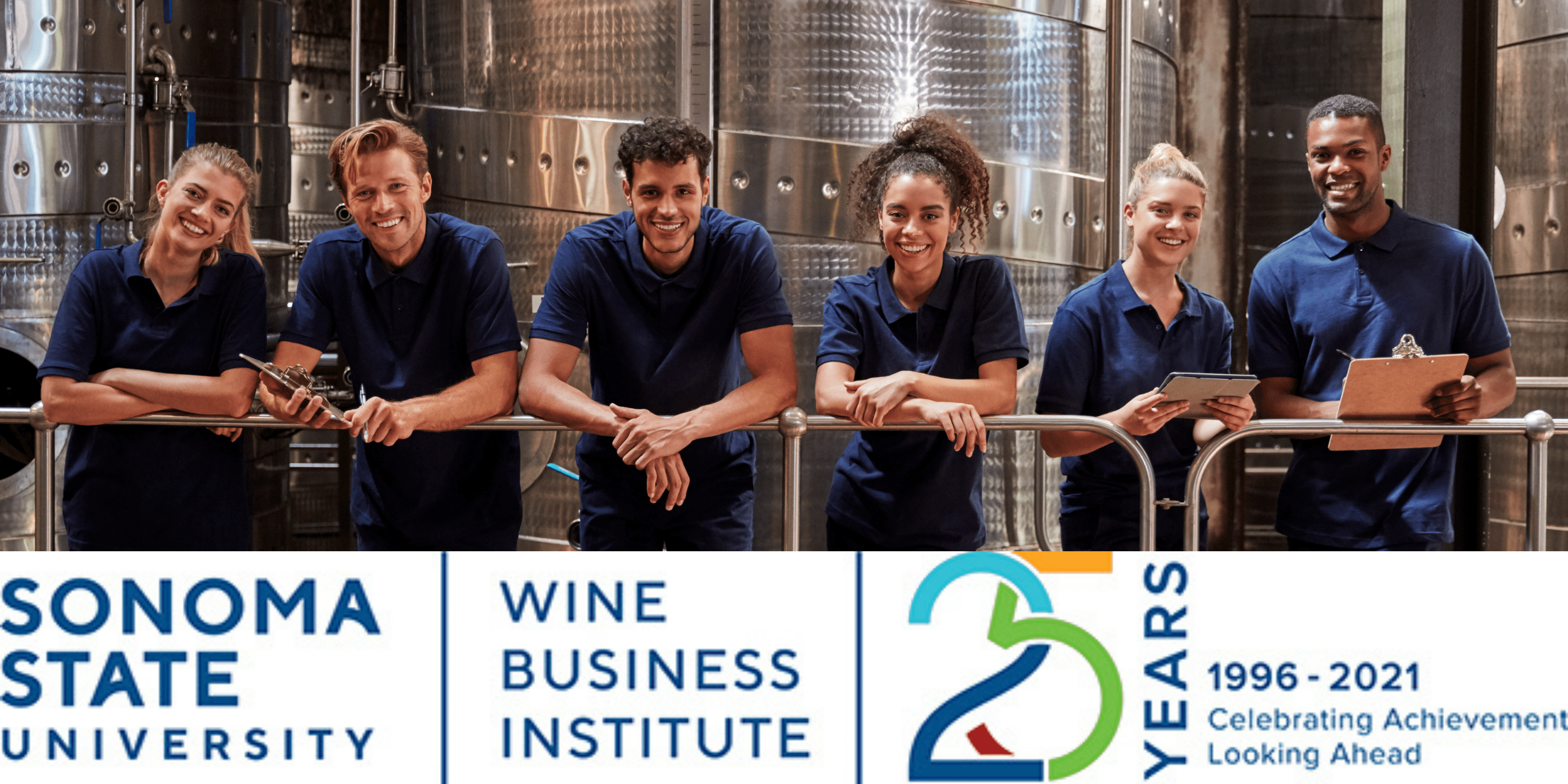 six_people_standing_in_front_of_wine_fermenters_and_leaning_on_railing_with_Wine_Business_Institute_Logo_below