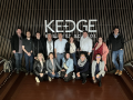 GWEMBA 4 students standing in front of Kedge Business School sign in Bordeaux, France.